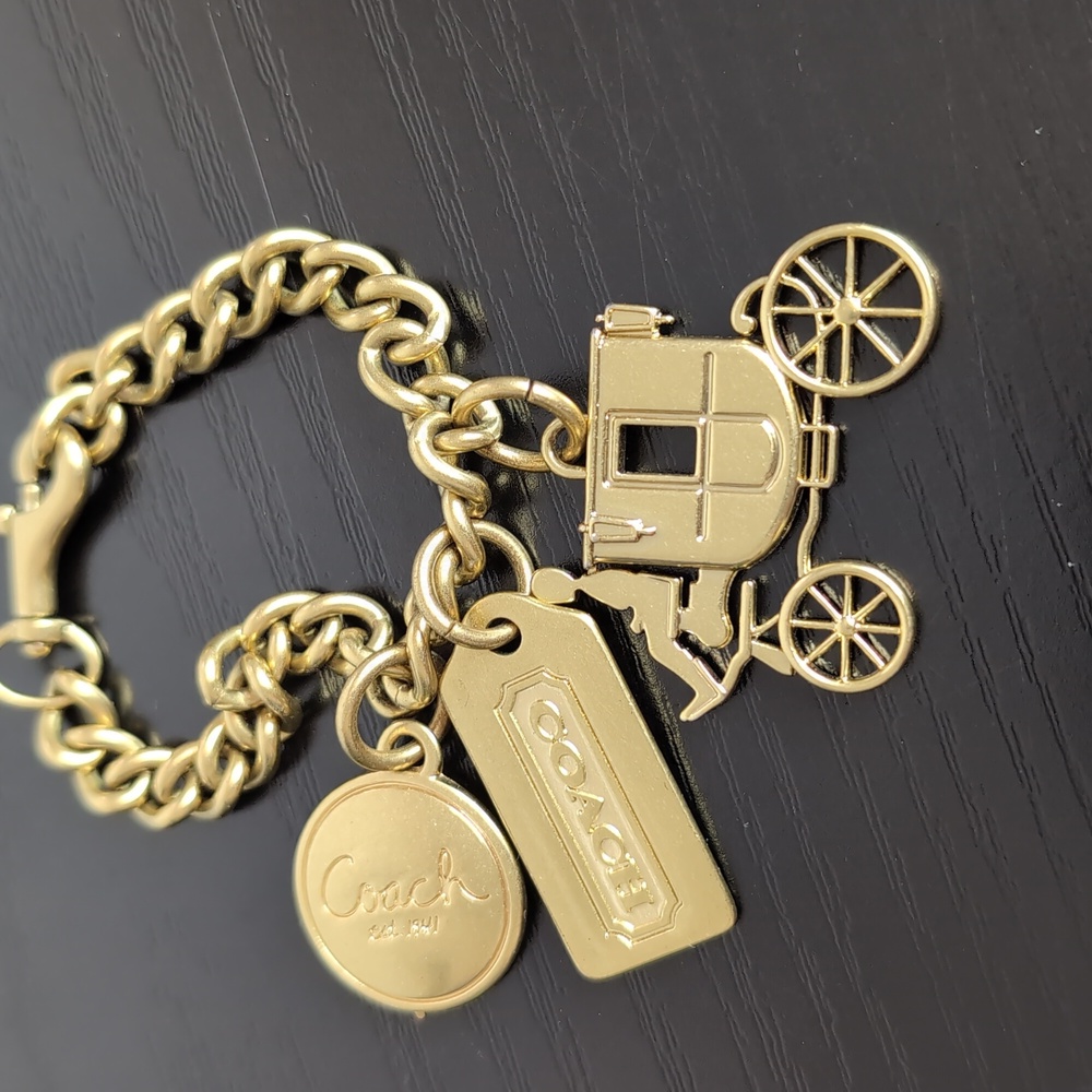 Coach Gold Tone Carriage Charm Bracelet
